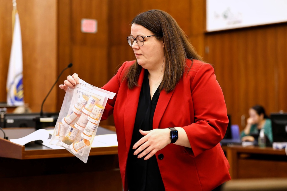 Jennifer Sprague, a prosecutor with the Plymouth County District Attorney's Office, enters a bag of prescription pills as evidence in Lindsay Clancy's trial (Greg Derr/Pool The Patriot Ledge)