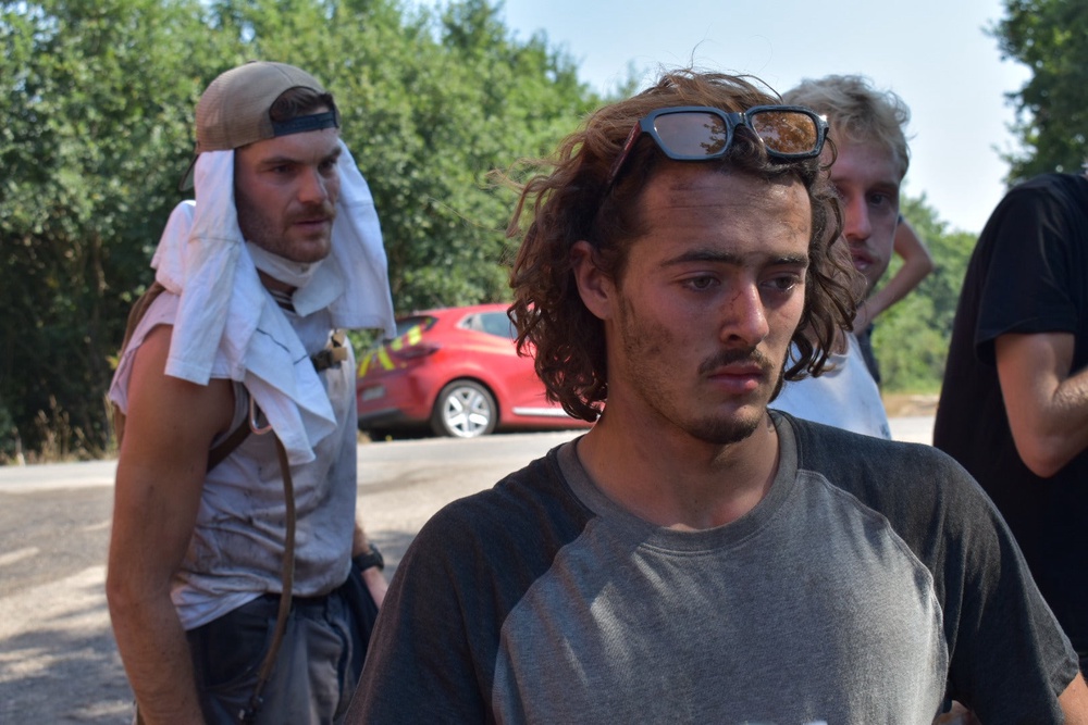 Mathias Monseigne, 18, was among a group of volunteers supporting fire crews at the Pont du Hourbiel in Lacanau again yesterday. He said he would continue until the fire is out (James Reynolds / The Independent)