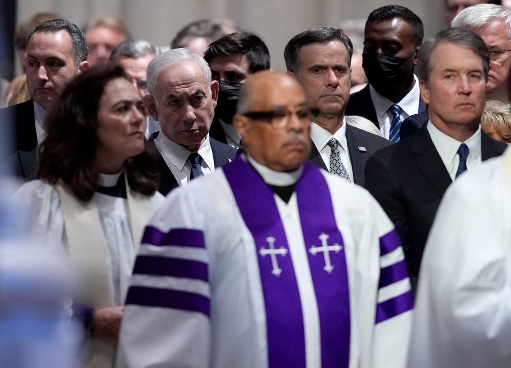 Israeli Prime Minister Benjamin Netanyahu, Central Intelligence Agency Director John Ratcliffe, and Supreme Court Associate Justice Brett Kavanaugh watch the procession at the funeral service (Getty Images)