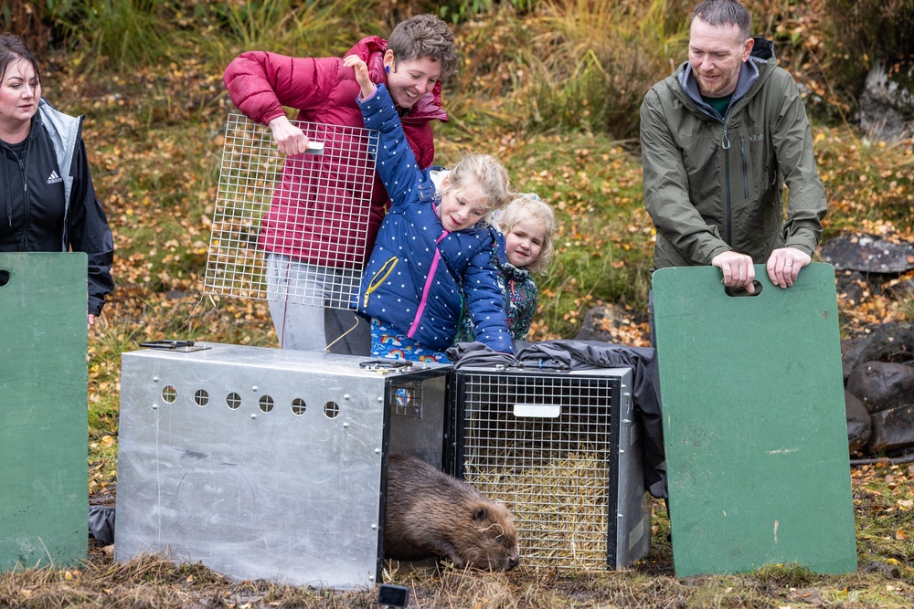 A family releasing the first beaver back into Glen Affric in October 2025. (Paul Campbell/PA)