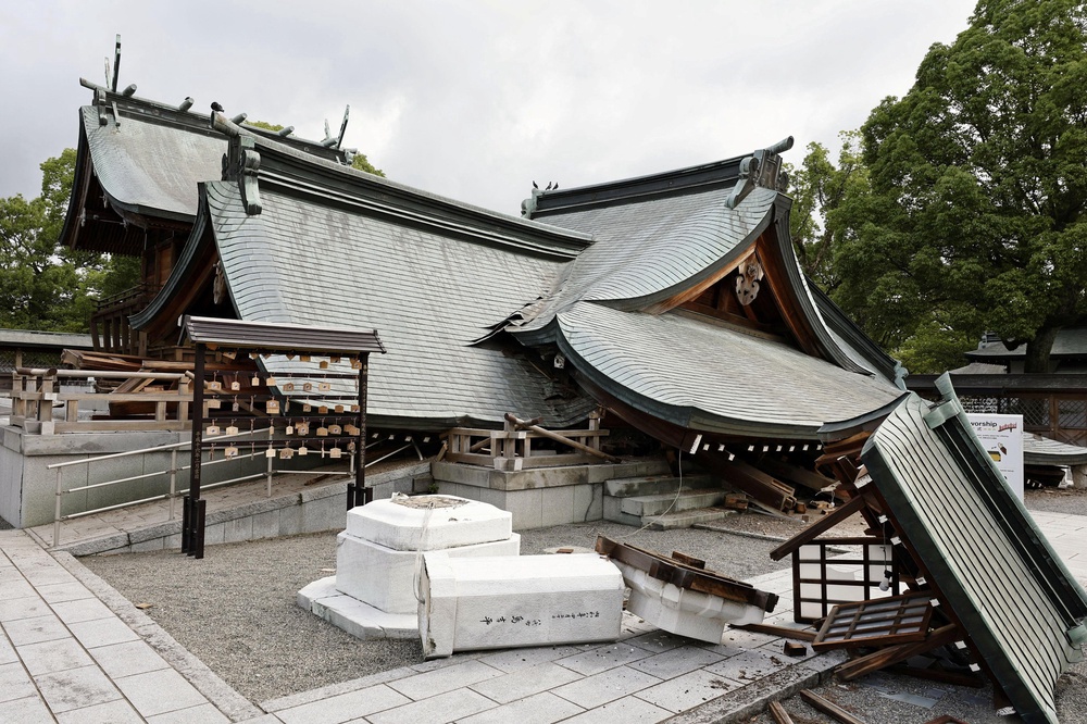 The collapsed worship hall of Yatshushiro Shrine after an earthquake with a magnitude of 7.1 struck Japan's southern Kumamoto prefecture (Reuters)