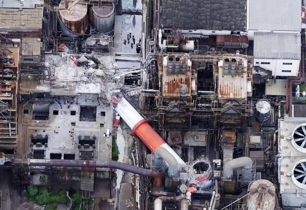 This aerial image shows a damaged chimney of the Nippon Paper Industries Co.’s Yatsushiro factory, following an earthquake in Yatsushiro, Kumamoto (AP)