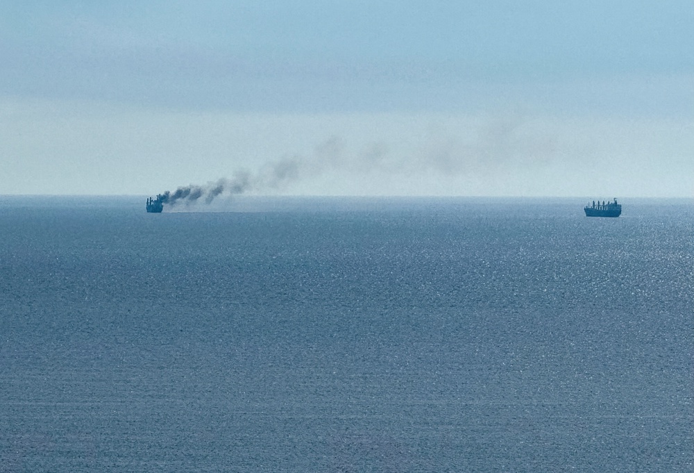 A civilian vessel is on fire, as Ukraine's navy spokesperson reported a Russian military strike on a civilian vessel (Reuters)