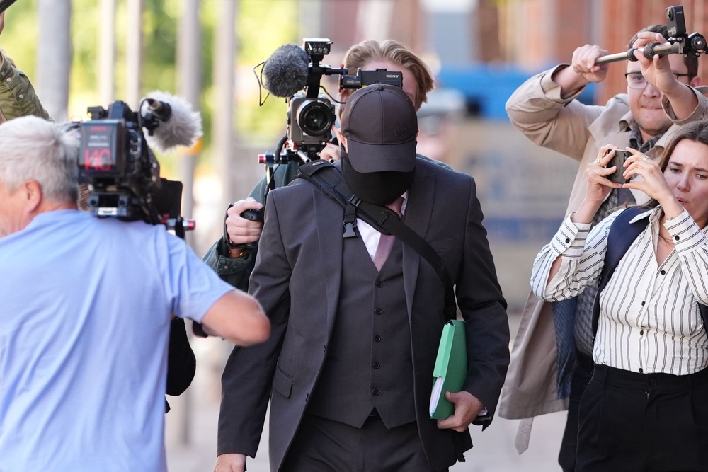 Funeral director Robert Bush, centre, arrives at Hull Crown Court (PA Wire)
