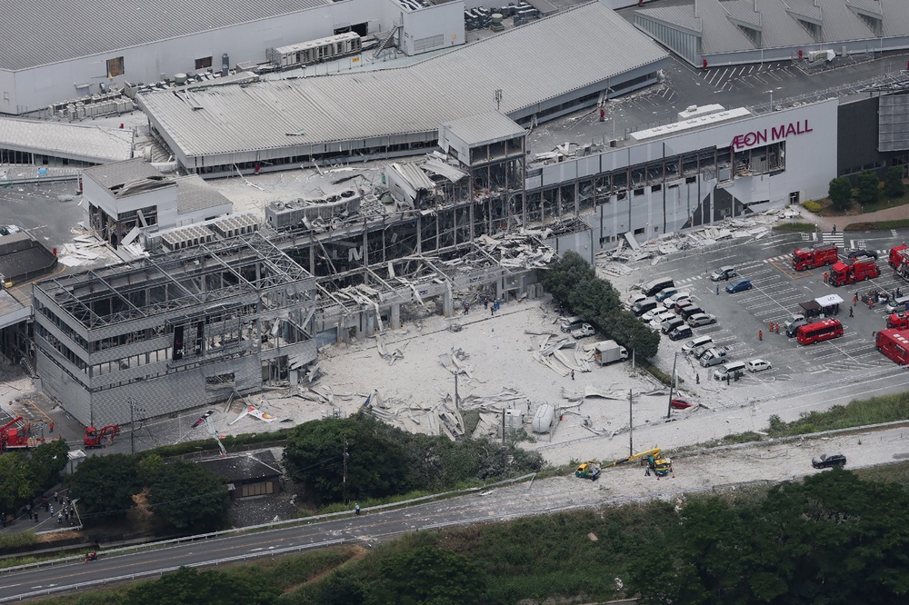 An aerial view shows rescue workers at Nippon Paper Industries factory after an earthquake with a preliminary magnitude of 7.1 struck Japan's southern Kumamoto prefecture, in Yatsushiro City, Kumamoto Prefecture (AFP/Getty)