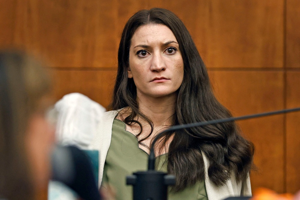 Lindsay Clancy waits for Judge William Sullivan to call a prospective jury member into court on day three of jury selection in her triple murder trial in Plymouth Superior Court in Plymouth, Massachusetts, July 22 (Reuters)