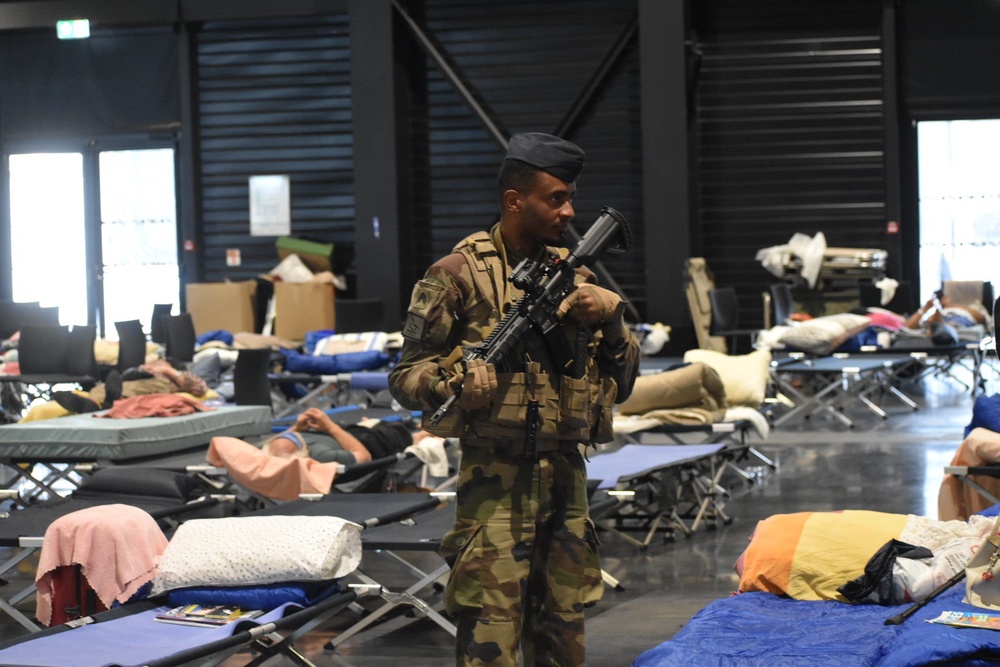 Security forces were on site at the displacement centre on Tuesday (James Reynolds / The Independent)
