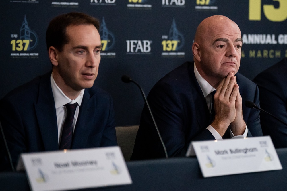 FA chief executive Mark Bullingham next to Infantino (PA)