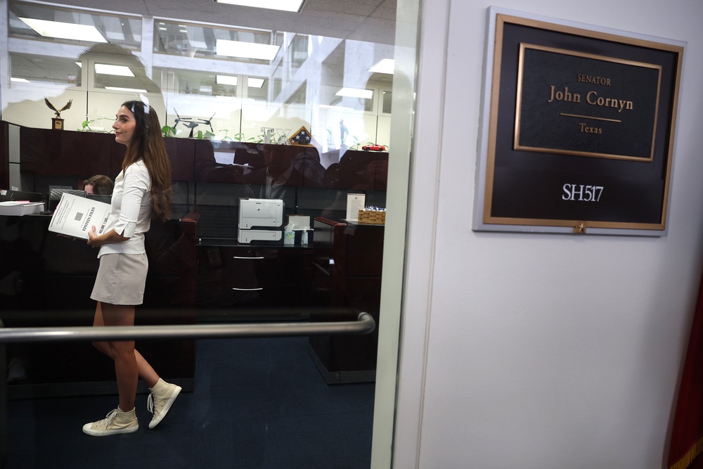 A survivor of Jeffrey Epstein stands inside Sen. John Cornyn's (R-TX) office at the Hart Senate Office Building on Wednesday. The Epstein survivors attempted to meet with Cornyn and Attorney General nominee Todd Blanche over the Department of Justice's handing of the Epstein files. (Getty)