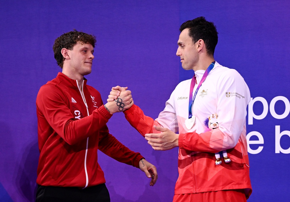 Guy, left, and Richards, training partners and friends, embraced at the end but it was hardly jubilant (Getty)