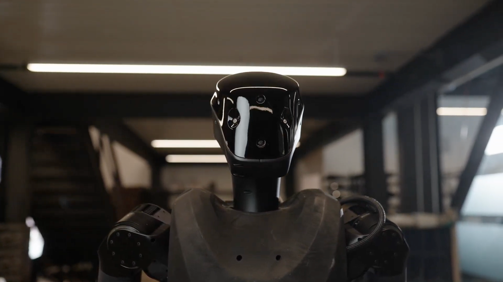 Foundation’s core offering is Phantom, an all-black, roughly six-foot tall humanoid robot with a sleek face shield (Courtesy of Foundation Future Industries)