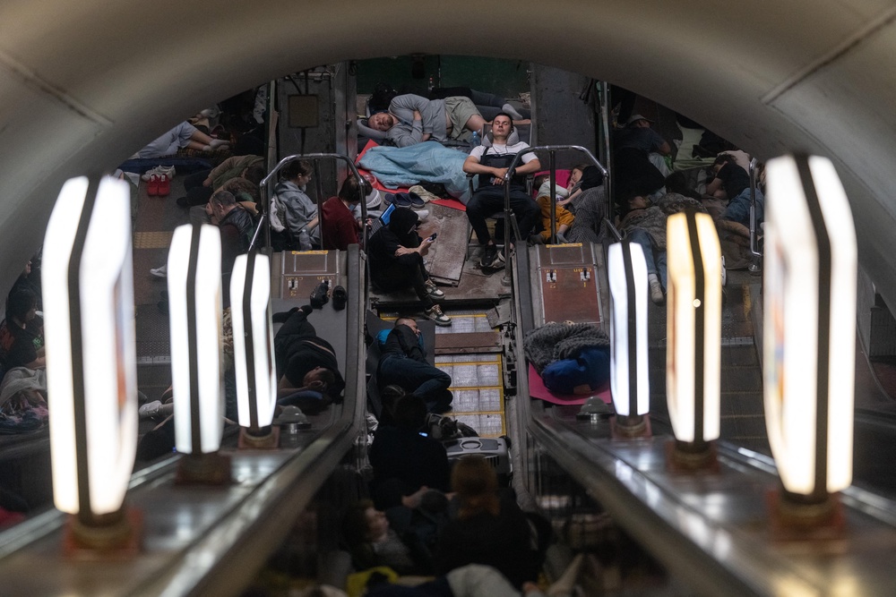 People take shelter at a metro station during Russian missile strike on Kyiv (AFP/Getty)