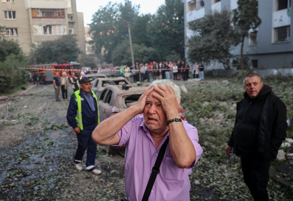 A man reacts near an apartment building hit by a Russian missile strike, amid Russia's attack on Ukraine, in Lviv, Ukraine July 30, 2026. REUTERS/Roman Baluk (Reuters)