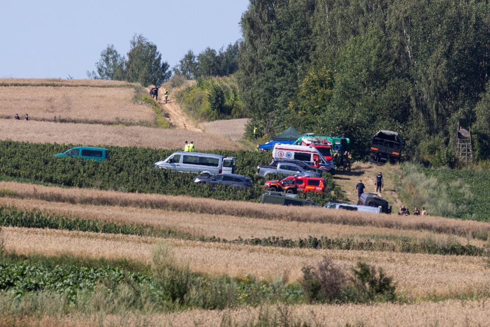 Emergency services work at the site where an unidentified flying object, believed to be a Russian cruise missile, fell after violating Polish airspace on Thursday (Reuters)