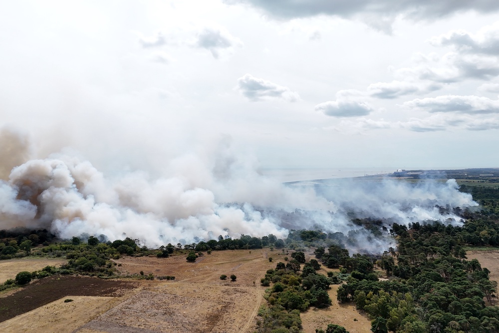Pictures show smoke covering scorched fields (PA)