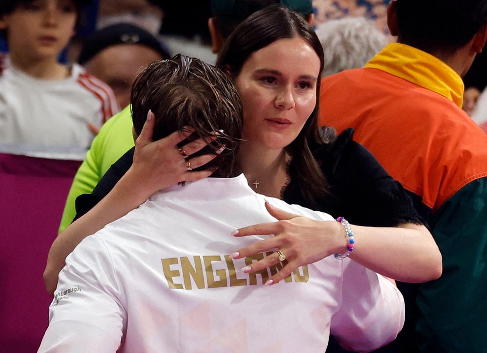 Ramsay-Peaty hugs his wife, Holly (Reuters)