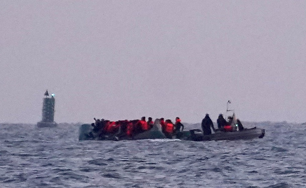 People head out to sea on board a small boat after leaving the beach near Dunkirk in France on Thursday (Gareth Fuller/PA) (PA Wire)