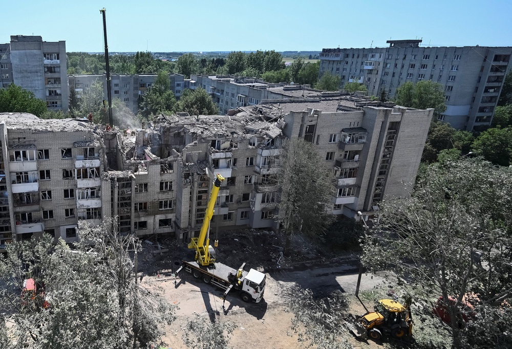 Rescuers continue to work at the site of an apartment building hit by a Russian missile strike in Lviv (Reuters)