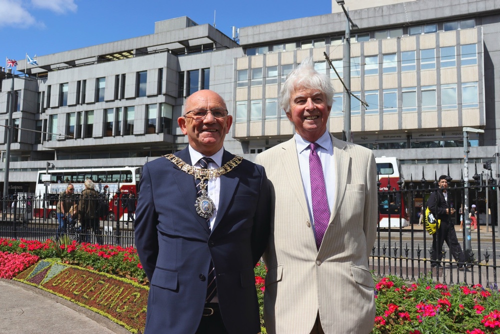 The Lord Provost of the City of Edinburgh, Robert Aldridge, with Sir Andrew Cubie, chair of the Trellis charity, which has been celebrated by the city’s annual floral clock display (Danyel VanReenen/PA)