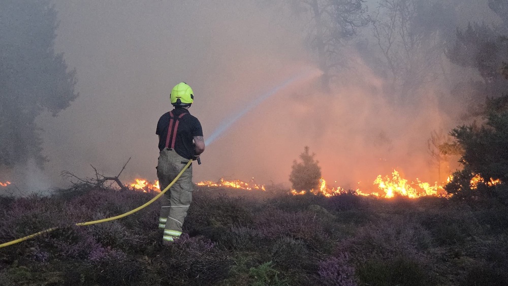 Firefighters at the scene of a wildfire at Dunwich Heath, near Leiston (Suffolk County Council/PA) (PA Media)