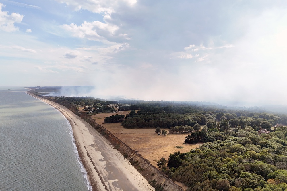 Smoke rises from a wildfire at Dunwich Heath (PA)