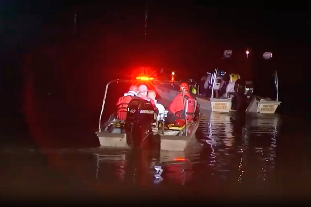 One child has died and another is missing after three children got trapped in a rain-swollen river in New Jersey (WABC-TV via AP)