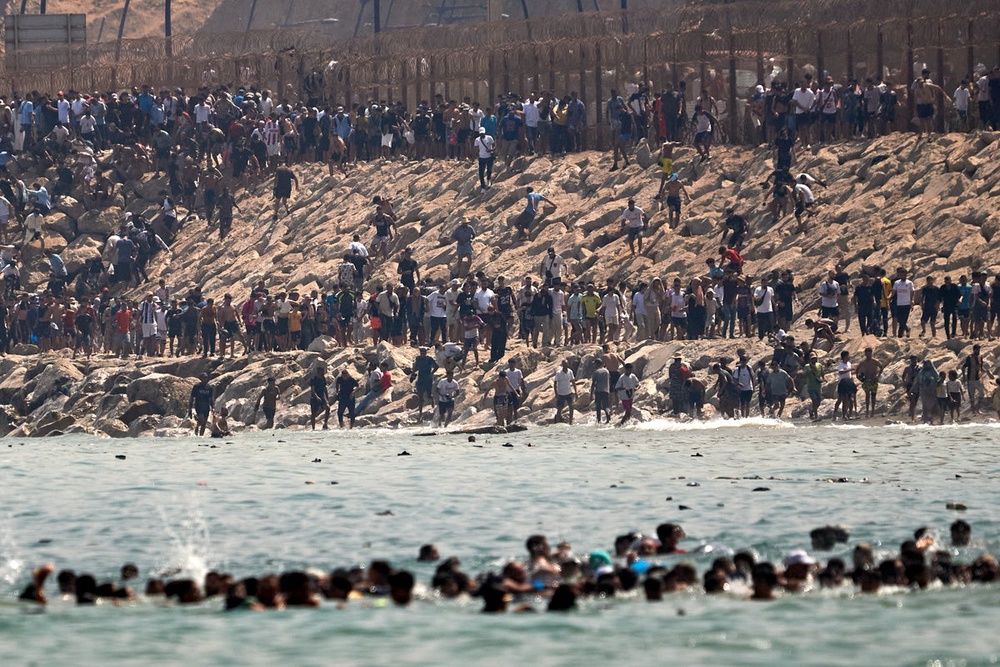 Image from: Ceuta latest: 60,000 migrants cross into Spanish enclave as death toll rises to 34 in growing crisis