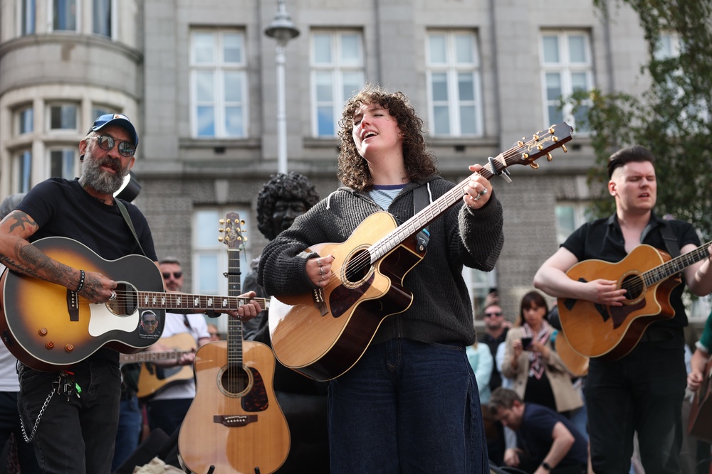 Musicians play in memory of Glen Hansard on King Street in Dublin (Damien Eagers/PA) (PA Wire)