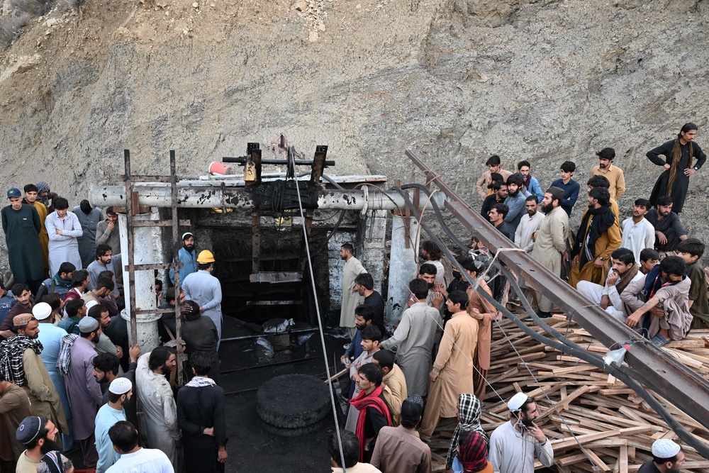 Coal miners and relatives gather at the entrance of a coal mine after it collapsed (AFP/Getty)