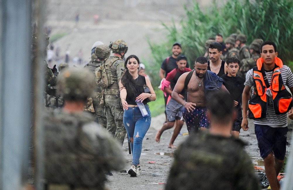 Migrants from Morocco arrive at the Spanish border, in Ceuta, Spain, July 31, 2026, as migrants cross into Ceuta by sea and land. (REUTERS/Fabian Bimmer) (Reuters)