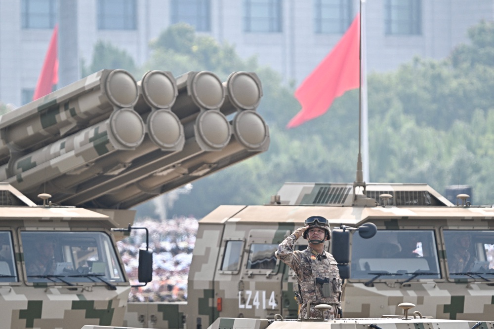 A Chinese military officer on a vehicle salutes during a military parade marking the 80th anniversary of victory over Japan and the end of World War II (AFP/Getty)
