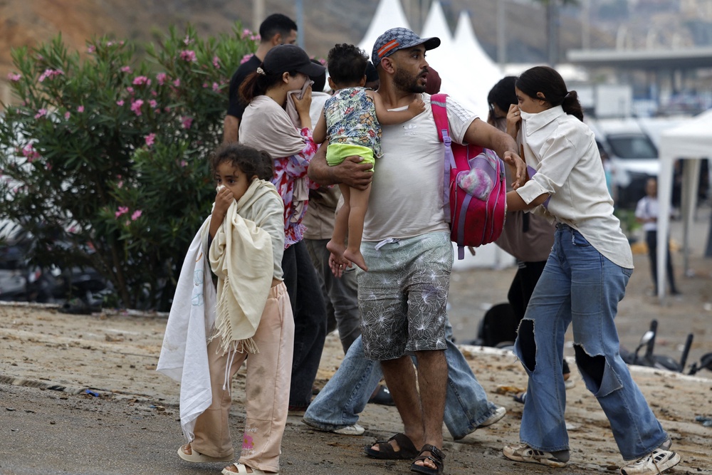 People react as they stand at the site of clashes near Fnideq, on the Morocco-Spain border, on July 31, 2026. (Photo by Abdel Majid BZIOUAT / AFP via Getty Images) (AFP/Getty)