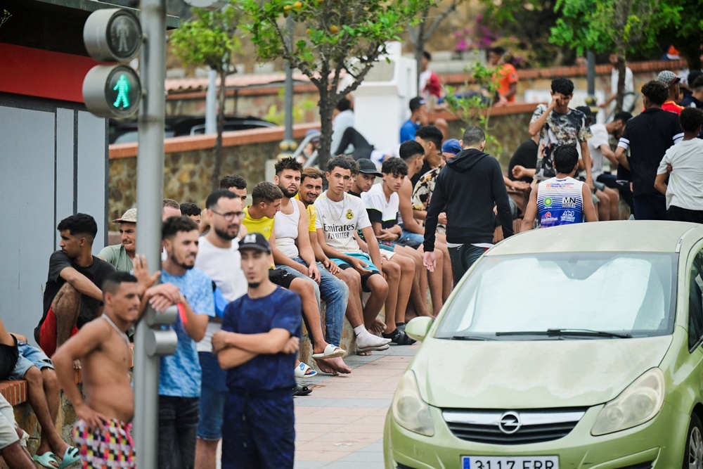 Migrants gather in downtown Ceuta, Spain, July 31, 2026, as migrants cross into Ceuta by sea and land. (REUTERS/Fabian Bimmer) (Reuters)