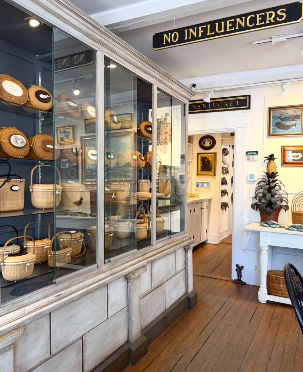 Four Winds Craft Guild, which specializes in luxury handwoven baskets and artisan accessories, displays a divisive ‘No Influencers’ sign in its store (Instagram / Four Winds Crafts Guild)