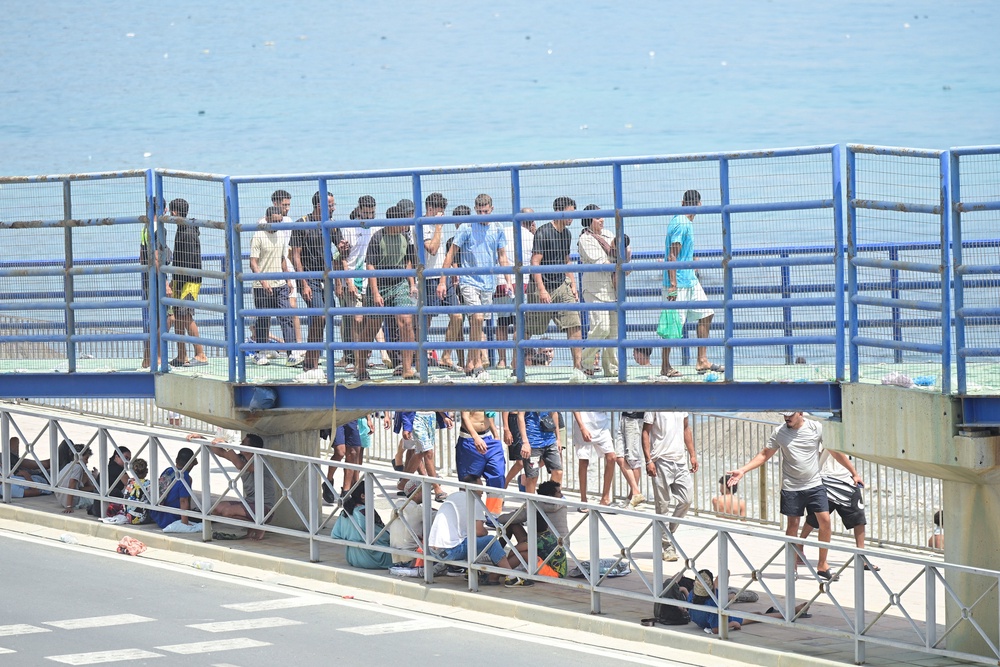 Migrants walk towards the border with Morocco to leave Spain, amid mass crossings of migrants on foot and by sea from Morocco into Spanish territory, in Ceuta, Spain, July 31, 2026. (REUTERS/Fabian Bimmer) (Reuters)