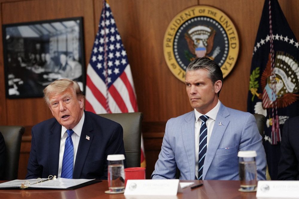 President Donald Trump speaks about thwarted Iranian missile strikes alongside Secretary of Defense Pete Hegseth during a Cabinet meeting at Camp David Friday (AFP/Getty)