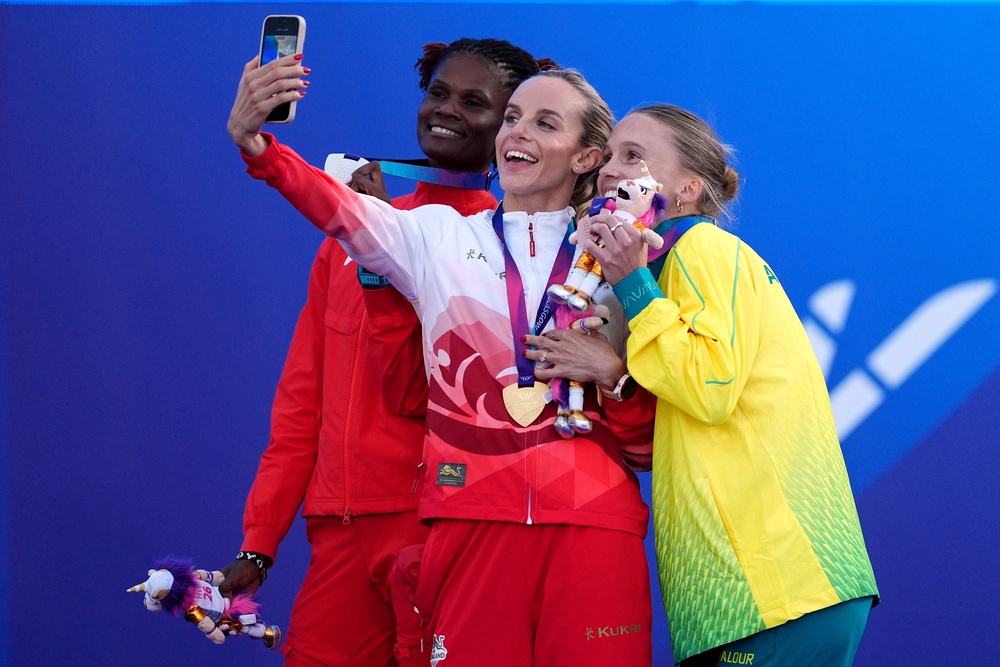 Hunter Bell, centre, celebrates with runner-up Lilian Odira and bronze medallist Sarah Billings (Martin Rickett/PA) (PA Wire)