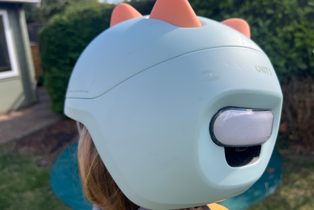 The helmet features a magnetic chin clasp (Sarah Dawson/The Independent)