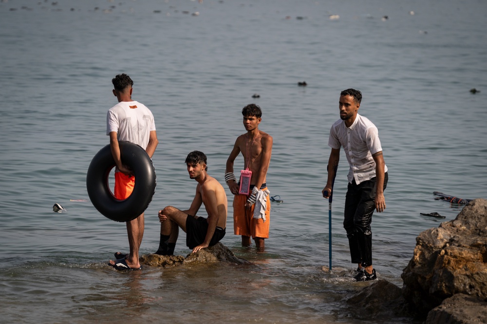Migrants arrive on Tarajal beach after crossing the border between Spain and Morocco (Getty)