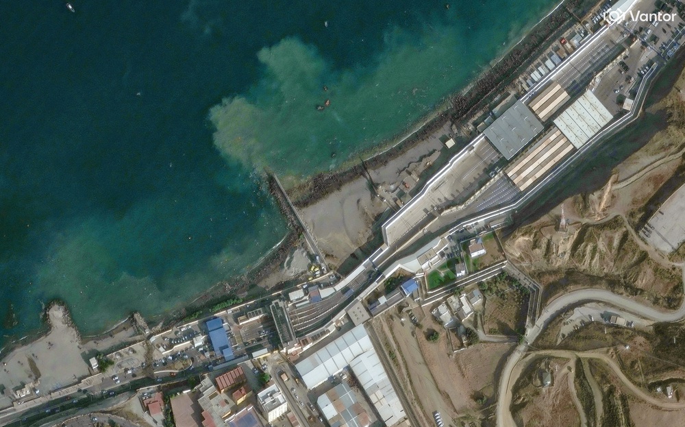 A satellite image shows an overview of crowds overrunning Spain's Ceuta border with Morocco, in Ceuta, Spain (Reuters)