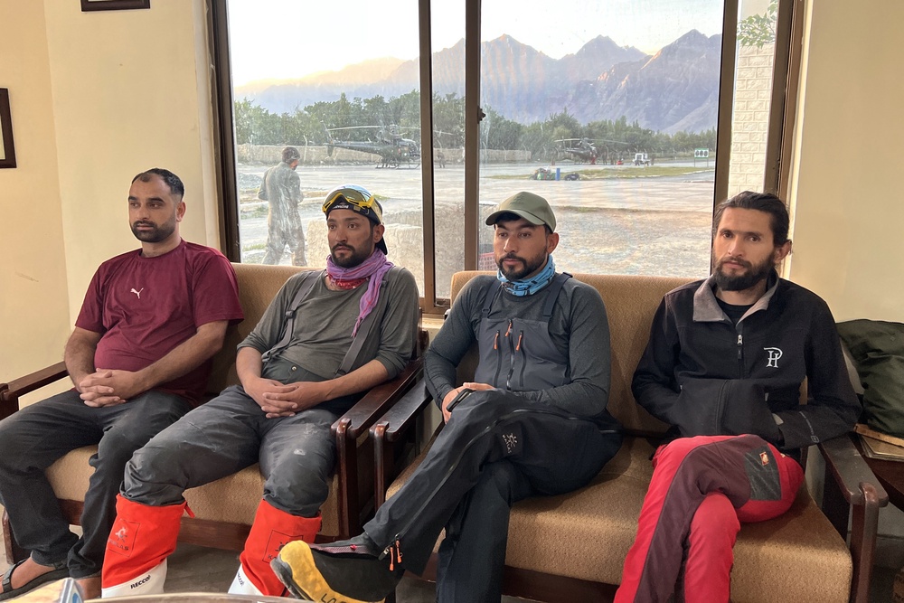 In this photo released by the Alpine Club of Pakistan on Friday, members of a mountaineer rescue team prepare to depart from an airbase on a search operation for climbers missing after an avalanche on Pakistan’s Broad Peak (AP)