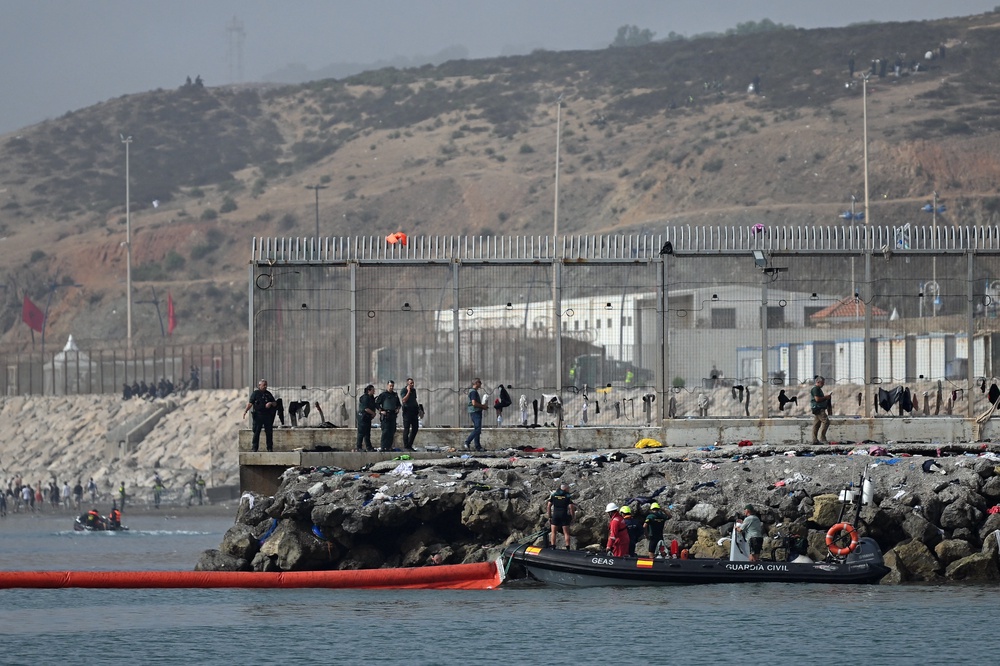 A 1,640 feet pneumatic barrier is deployed in the water by a Spanish Guardia Civil boat near the border post to reinforce security (AFP/Getty)