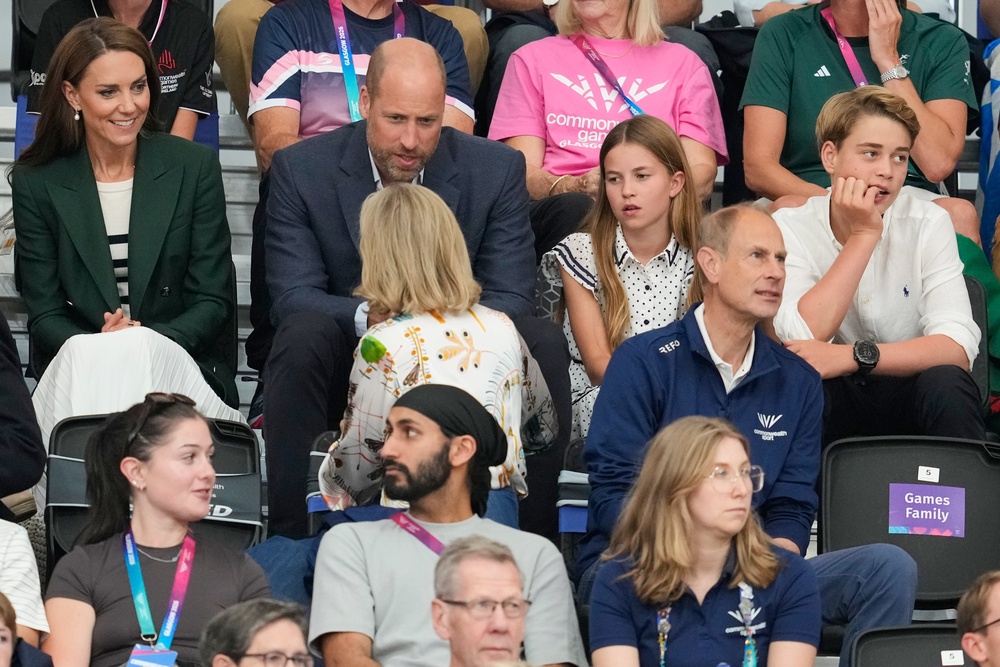 Kate, Princess of Wales, and William, Prince of Wales speak with Sophie, Duchess of Edinburgh as they sit with their children Princess Charlotte and Prince George in the audience to watch the track cycling (AP)