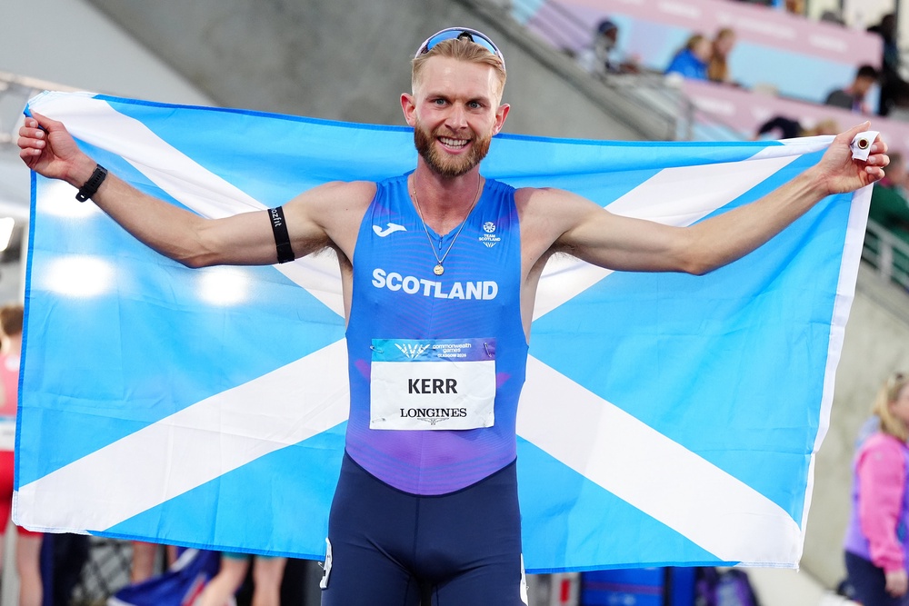 Josh Kerr celebrated his success in Glasgow (Martin Rickett/PA) (PA Wire)