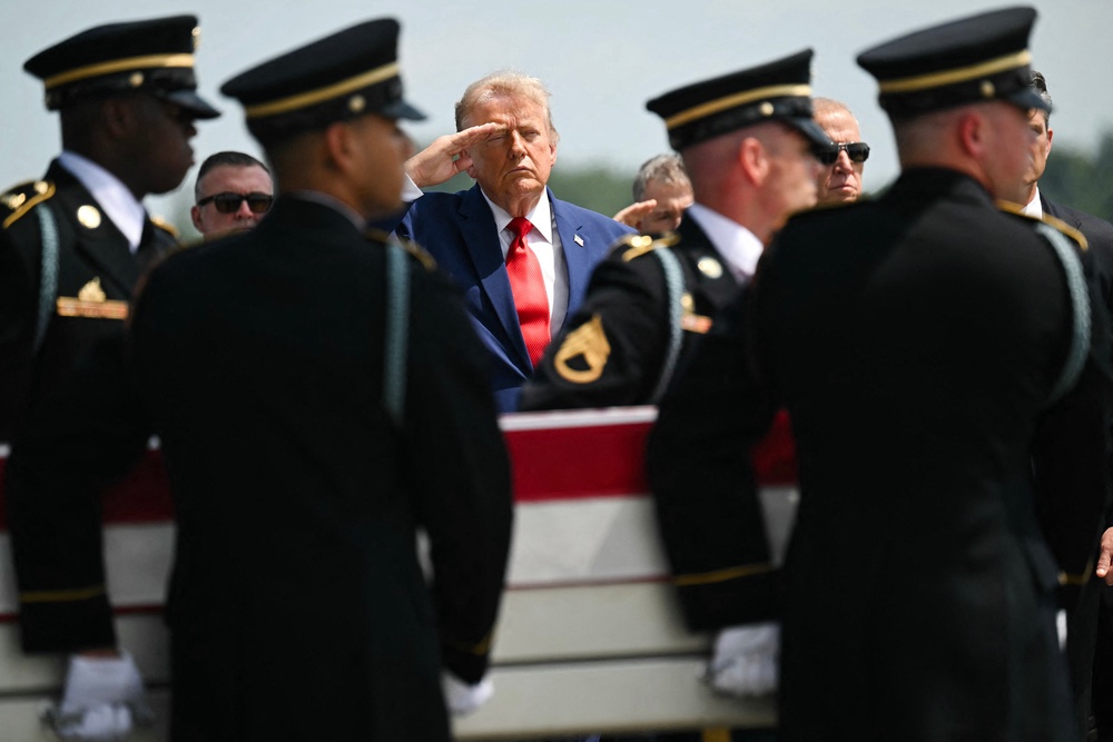 To date, 18 U.S. service members have been killed and hundreds have been wounded, the Pentagon has said. Pictured: Trump salutes at a dignified transfer of the remains of deceased service members on July 22 (AFP via Getty Images)