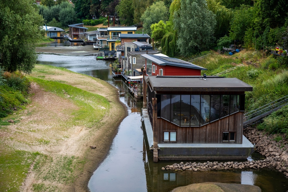 Houseboats sit in low water on the Waal river (AP)