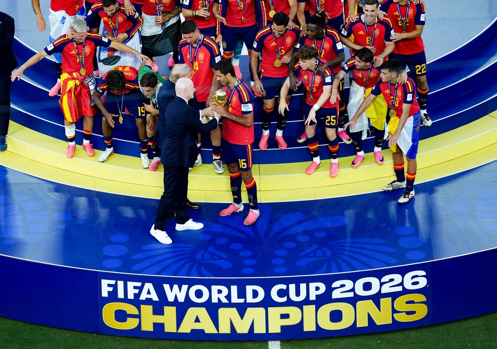 FIFA president Gianni Infantino presents the World Cup trophy to Spain (Martin Rickett/PA)