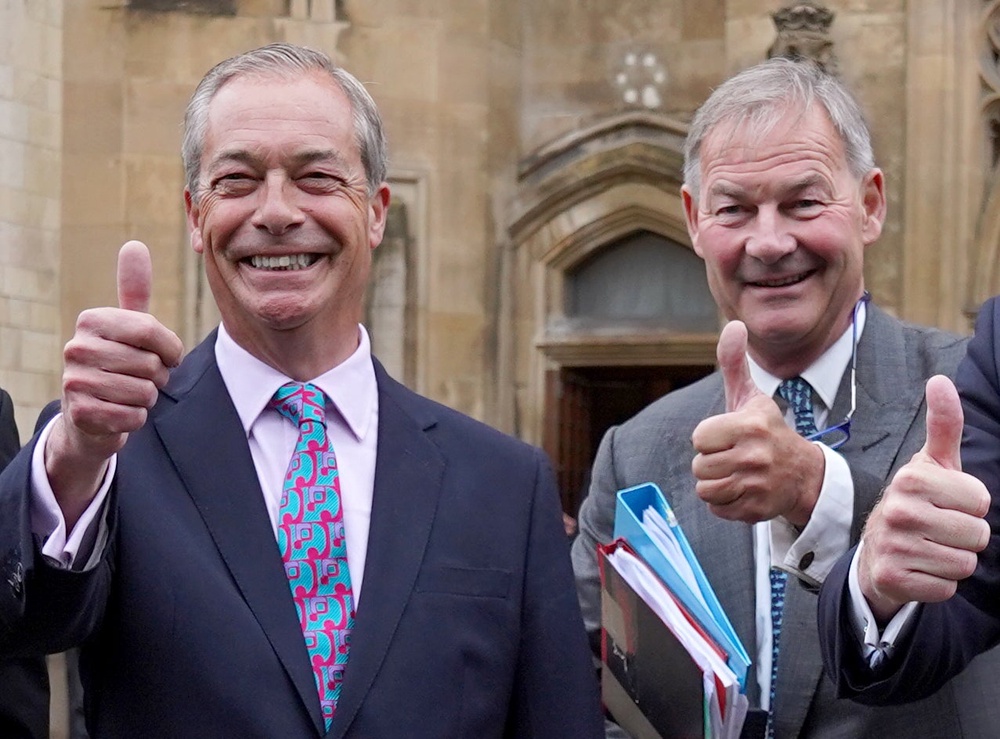 Nigel Farage and Rupert Lowe arrive at the House of Commons together in July 2024 after both being elected as Reform UK MPs (PA)