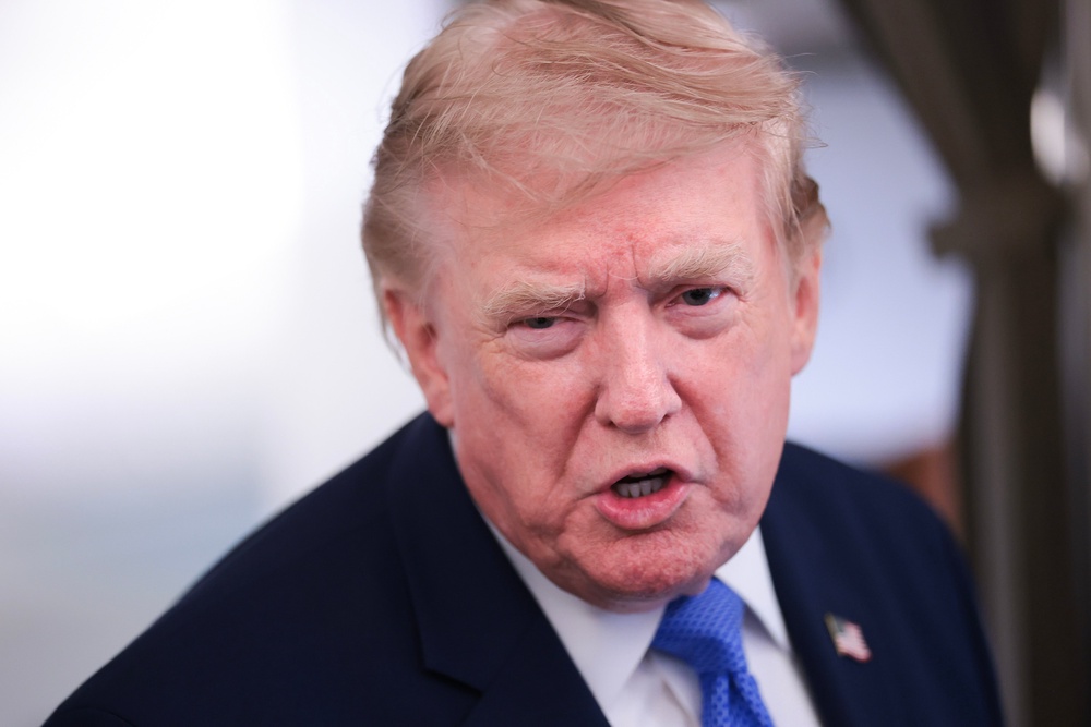 Trump renewed his threats against Canada Sunday evening in a gaggle with reporters aboard Air Force One. ‘You’ll find out about it,’ he told a reporter of his plans (Getty)
