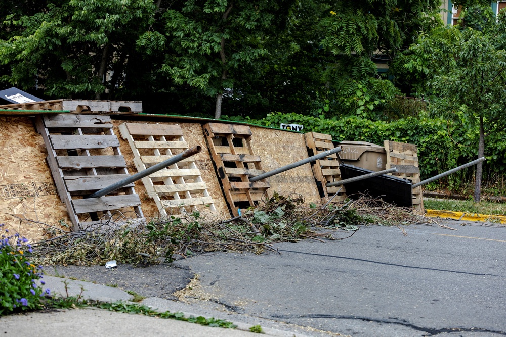 Makeshift barricades stand outside a memorial for Corey Ruiz at the site where he was shot and killed by police on July 22 in Madison, Wisconsin (Reuters)
